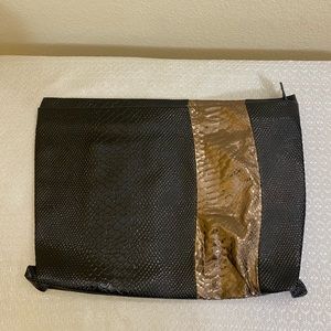 Beautiful and elegant envelope bag in black & metallic gold animal print design.